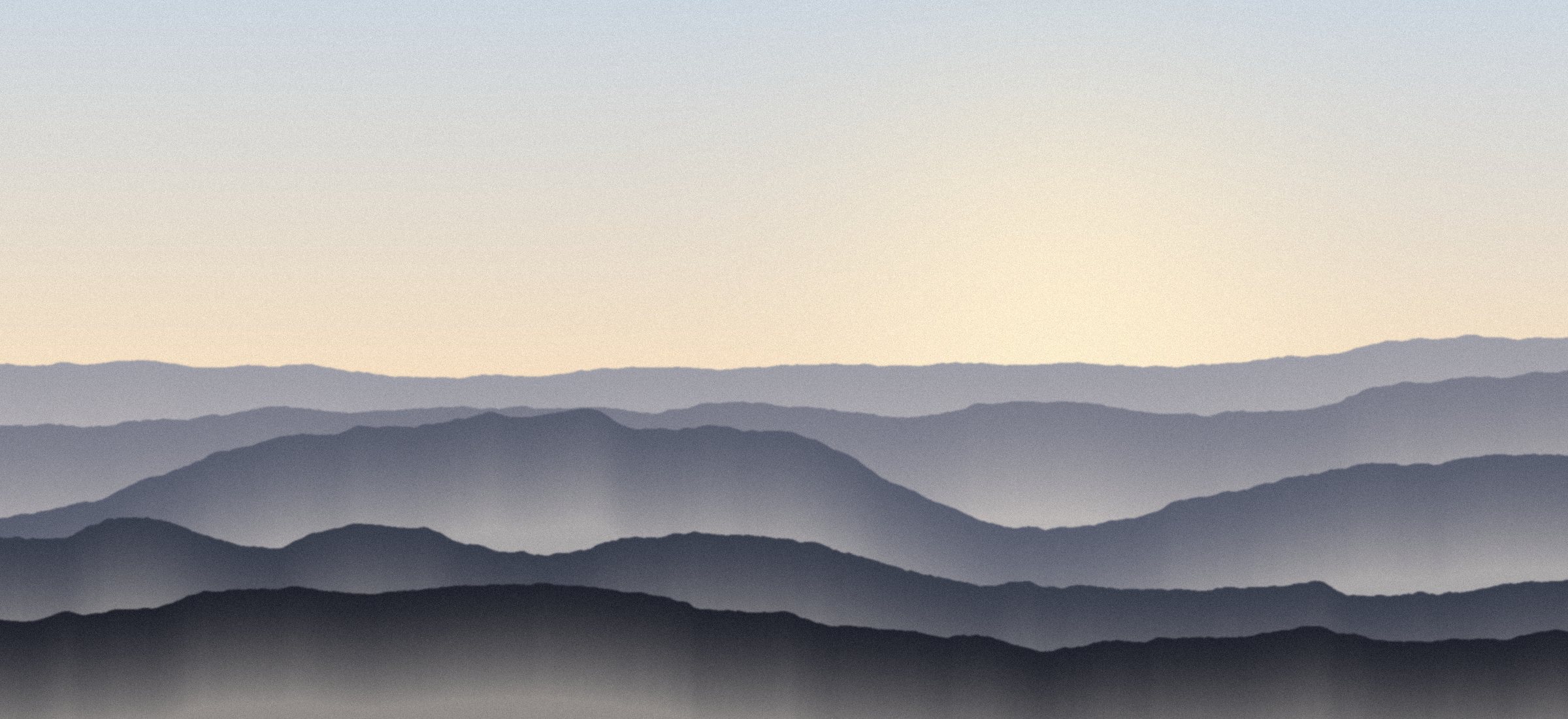 Layered hills at first light